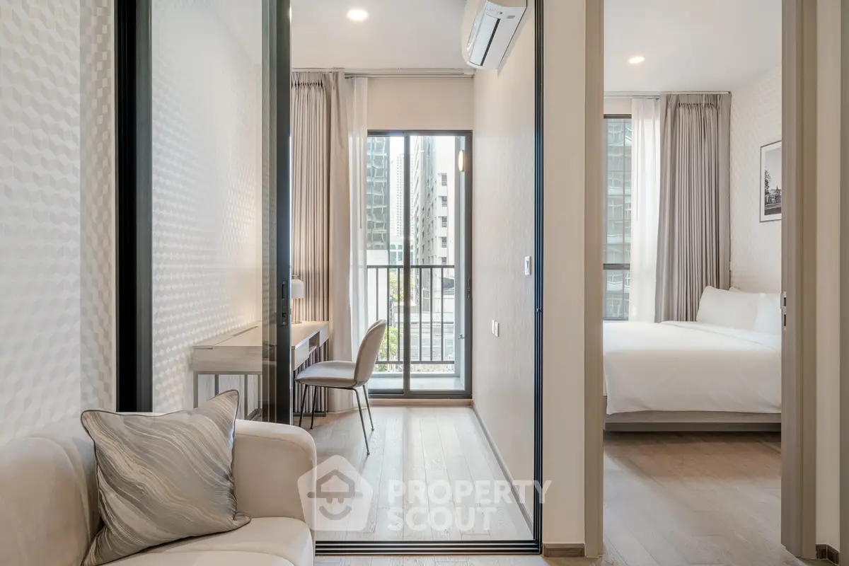 Modern apartment interior with cozy living area and bedroom, featuring stylish decor and natural light.