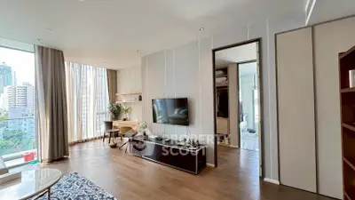 Modern living room with large windows and stylish decor in urban apartment