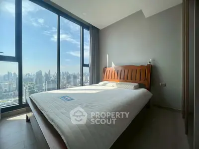 Stunning bedroom with panoramic city view and modern furnishings