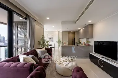 Luxurious modern living room with open kitchen and city view