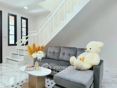 Charming living room with plush sofa, elegant decor, and cozy ambiance perfect for relaxation.