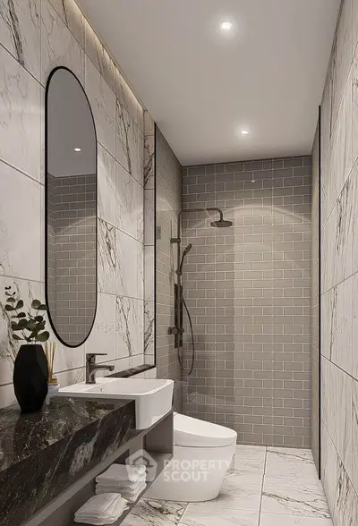 Modern bathroom with marble tiles and sleek fixtures