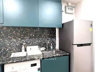 Modern kitchen with terrazzo countertop and sleek appliances