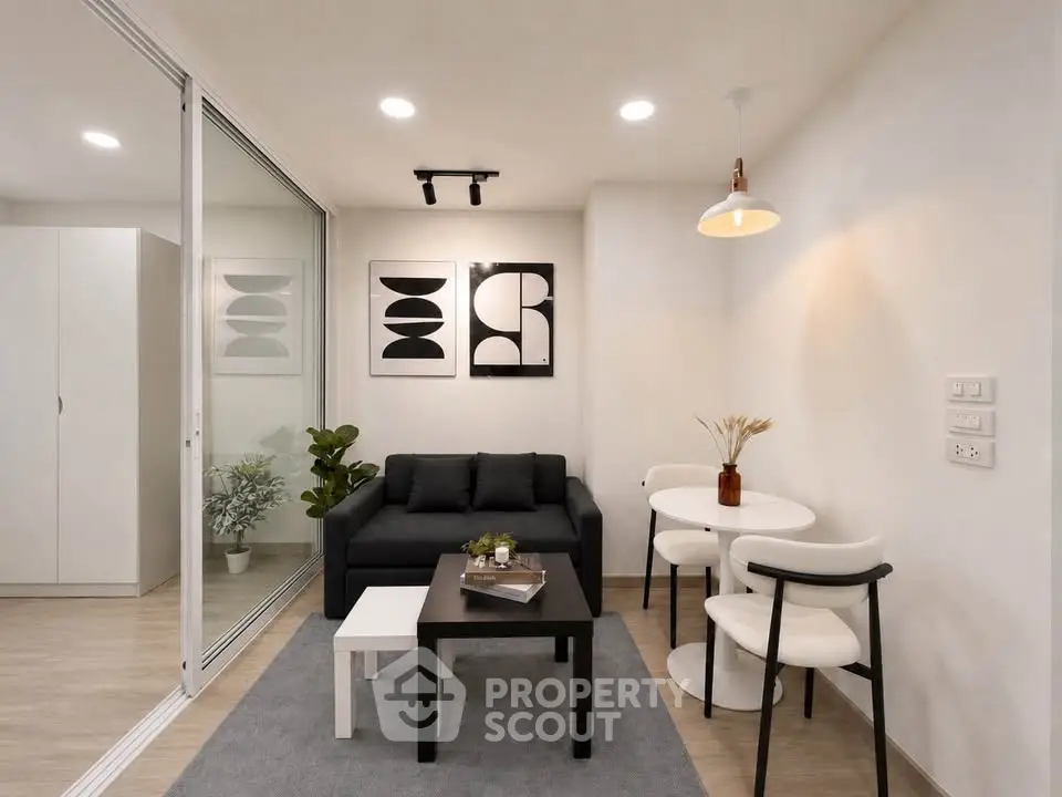 Modern living room with sleek furniture and stylish decor in a cozy apartment setting.