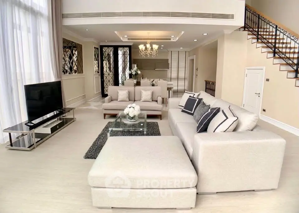 Luxurious living room with elegant decor and modern furniture in a spacious open layout.