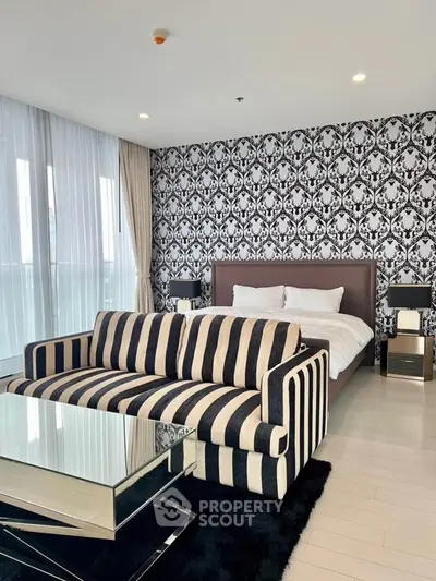 Luxurious bedroom with stylish decor and modern furniture in a high-end apartment.
