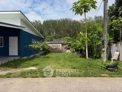 Charming suburban home with lush greenery and spacious yard, perfect for family living.