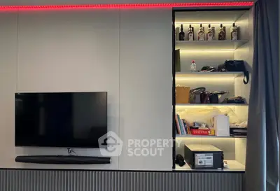 Modern living room with wall-mounted TV and stylish shelving unit