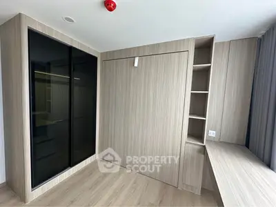 Modern minimalist study room with built-in shelves and desk