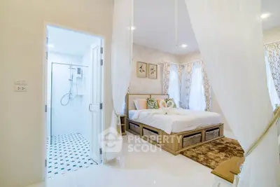 Elegant bedroom with ensuite bathroom, featuring a cozy bed and stylish decor, perfect for modern living.