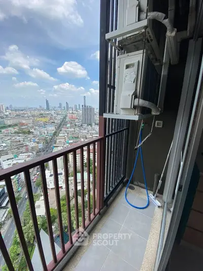 High-rise balcony with stunning cityscape view and air conditioning unit.