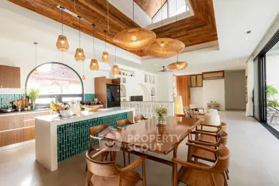 Stunning open-layout kitchen with modern wooden accents and ample natural light