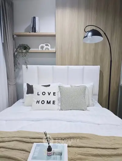 Cozy bedroom with stylish decor and modern lighting