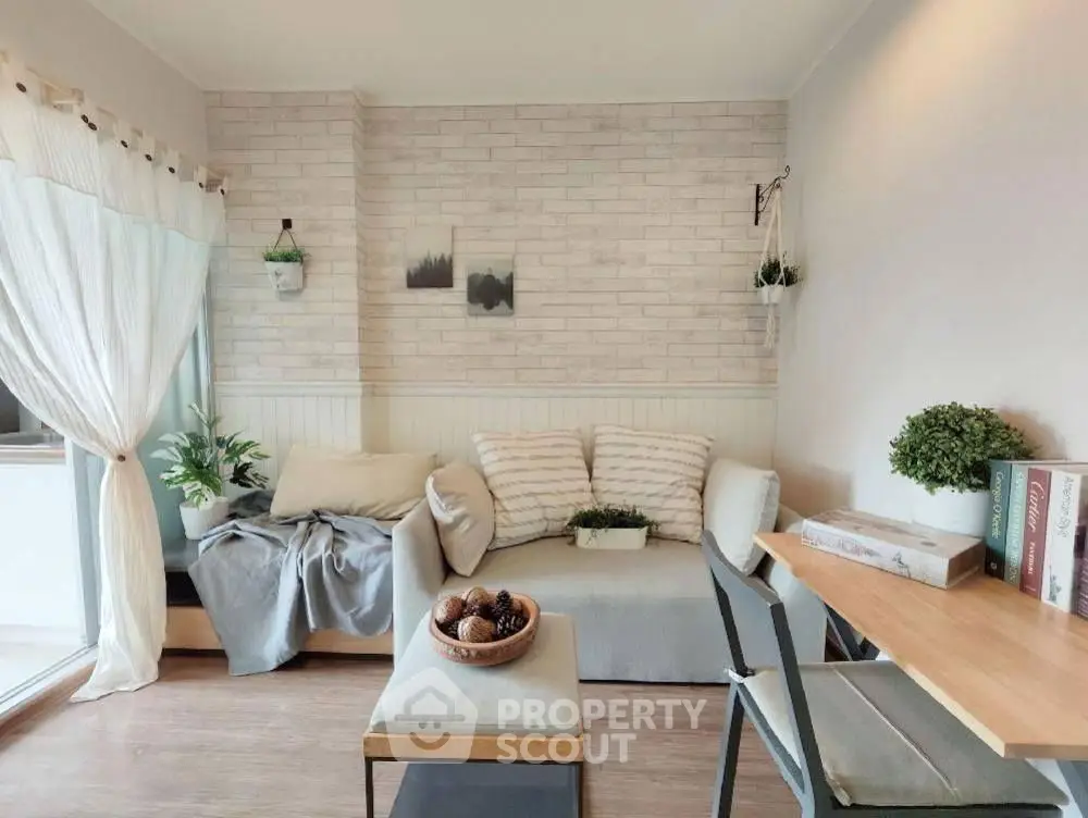 Charming living room with cozy seating and stylish decor, perfect for relaxation and entertaining.
