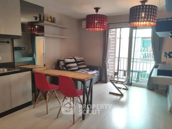 Modern living room with stylish decor and balcony access