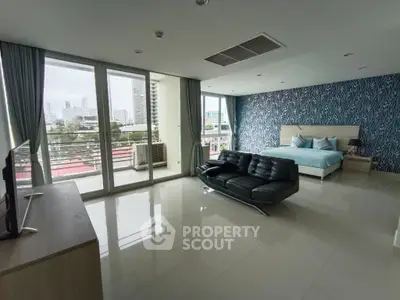 Spacious modern living room with city view and stylish decor