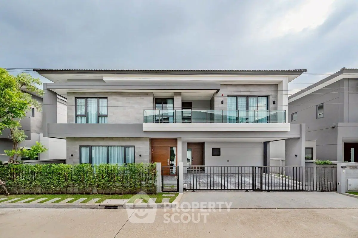 Modern two-story house with sleek design and spacious driveway