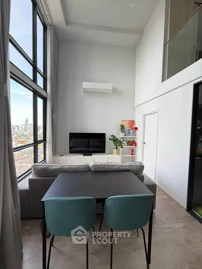 Modern high-ceiling living room with large windows and city view, featuring stylish furniture and minimalist decor.