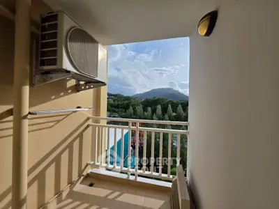 Charming balcony with scenic mountain view, perfect for relaxation and enjoying nature's beauty.