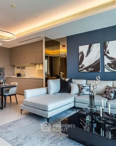 Luxurious modern living room with elegant decor and open kitchen layout.