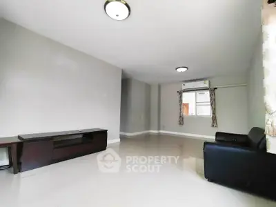 Spacious living room with modern furniture and natural light