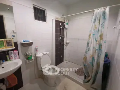 Modern bathroom with shower and toilet in a cozy home setting