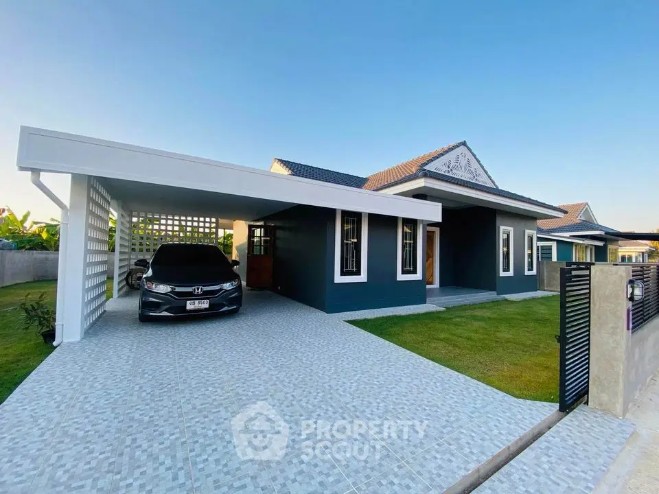 Modern single-story house with carport and spacious driveway