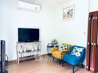 Charming living room with colorful chairs and modern decor