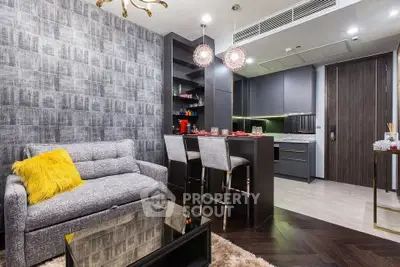 Modern open-layout living room with stylish kitchen and cozy seating area.