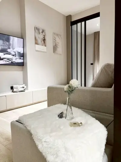 Cozy living room with modern decor and plush seating