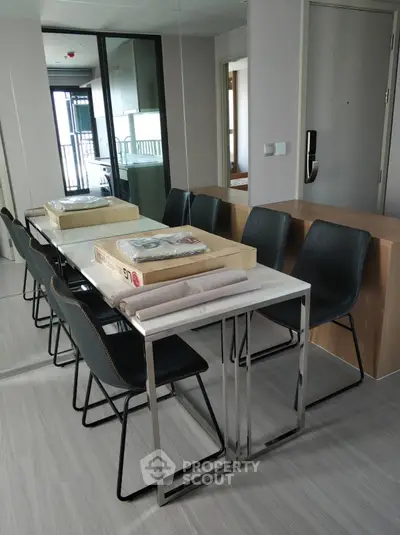 Modern dining area with sleek table and chairs in stylish apartment
