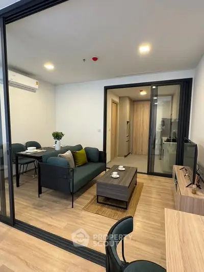 Modern living room with sleek furniture and open layout in a stylish apartment.