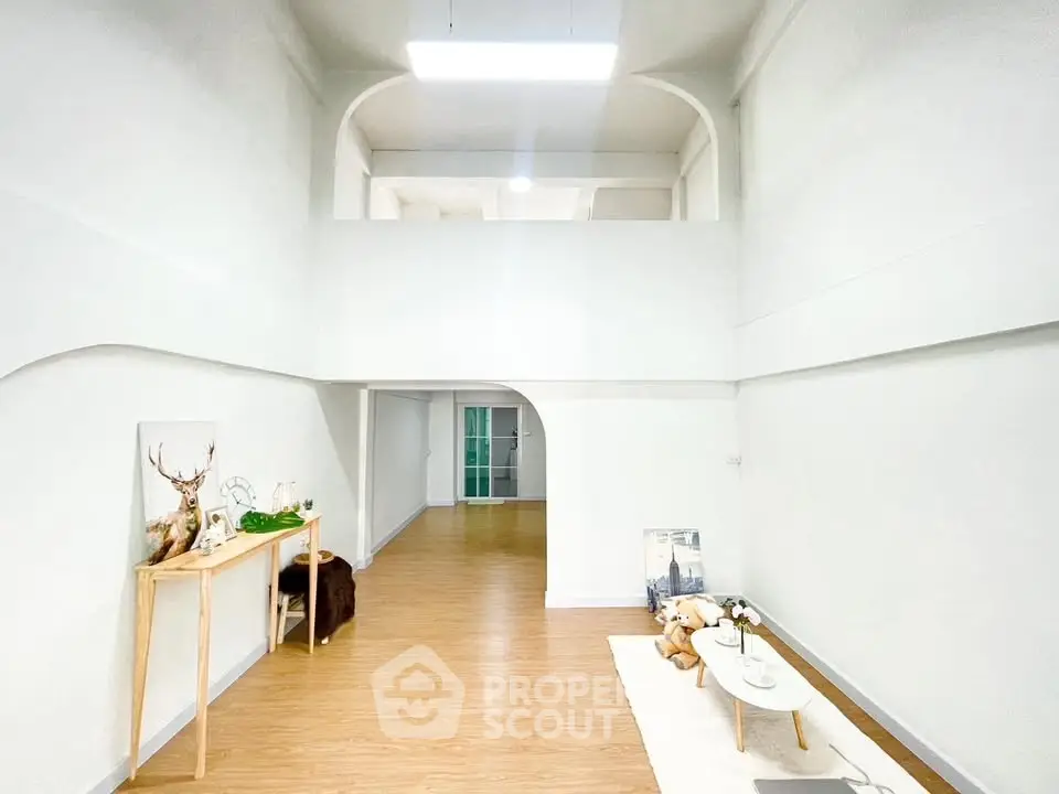 Spacious modern living room with high ceilings and minimalist decor