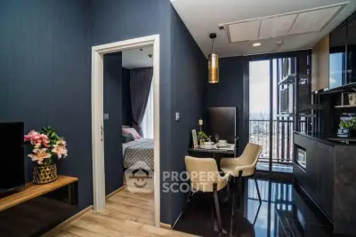 Chic modern apartment with open kitchen and cozy dining area, featuring stylish decor and city view.