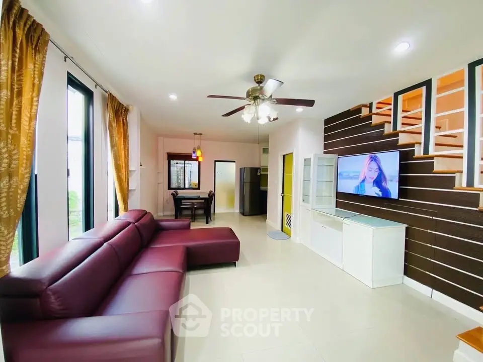 Spacious living room with modern decor and large sectional sofa