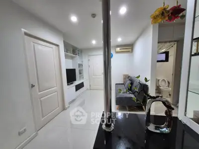 Modern living room with sleek design and cozy ambiance, featuring a comfortable sofa and stylish decor.