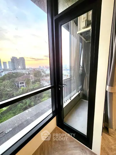 Stunning balcony view with cityscape and sunset, perfect for urban living enthusiasts.