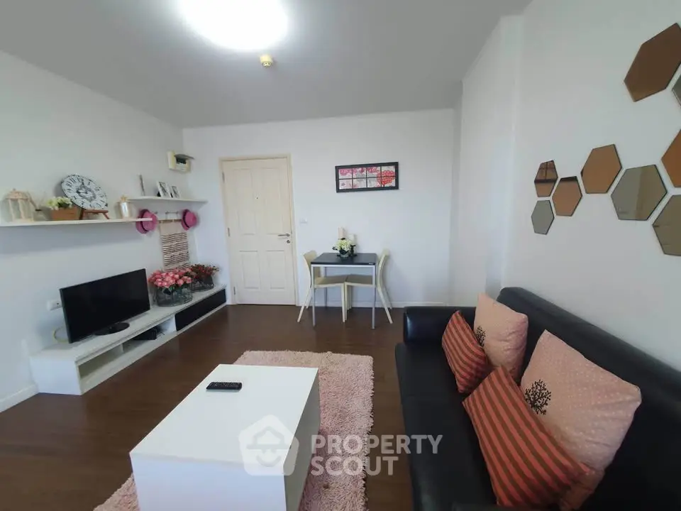 Charming living room with modern decor and cozy seating area, perfect for relaxation.
