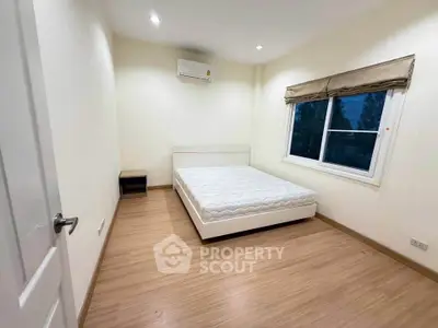 Spacious bedroom with minimalist design and natural light