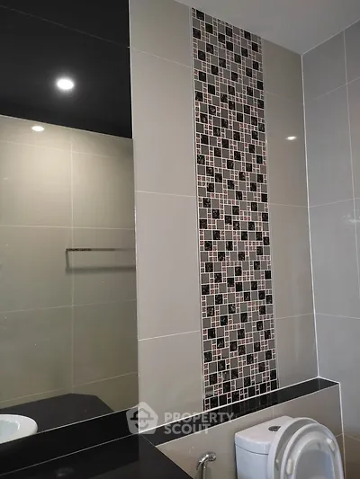 Modern bathroom with stylish tile design and sleek fixtures