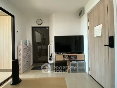 Modern living room with sleek TV setup and stylish storage solutions