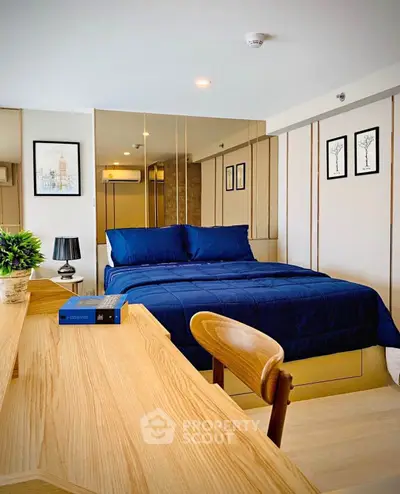 Modern bedroom with stylish decor and wooden furniture