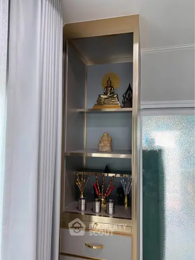 Elegant interior with modern shelving and decorative accents in a stylish living space.