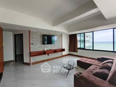 Spacious living room with ocean view and modern decor