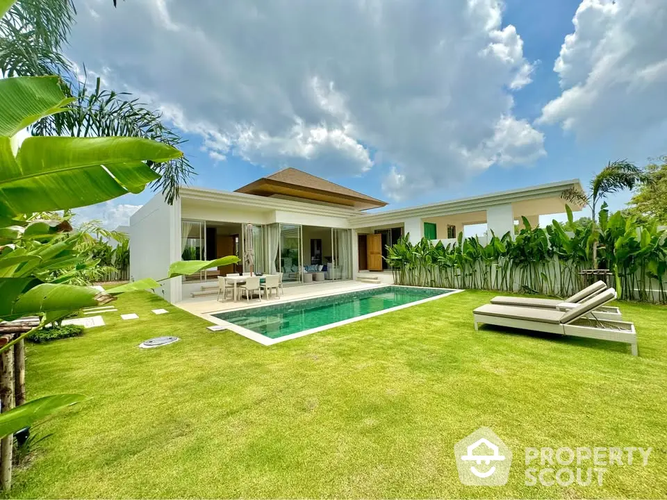 Luxurious modern villa with private pool and lush garden, perfect for serene living.