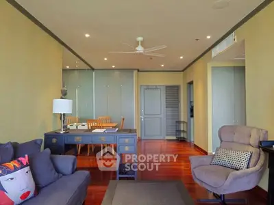 Spacious living room with elegant decor and hardwood floors in modern apartment.