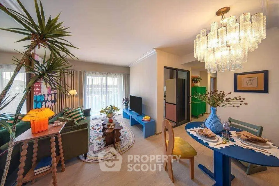 Stylish living room with vibrant decor and modern lighting in a cozy apartment.