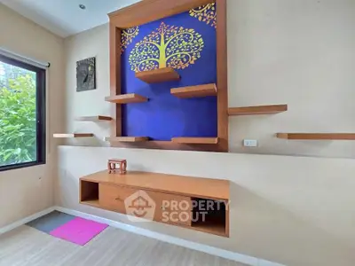 Stylish modern living room with unique wooden wall shelves and vibrant blue accent wall.