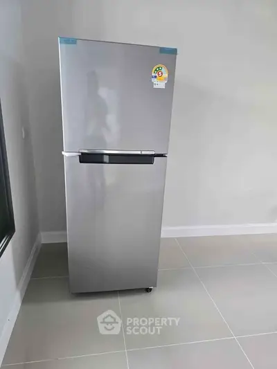 Modern stainless steel refrigerator in a sleek kitchen setting, perfect for contemporary homes.