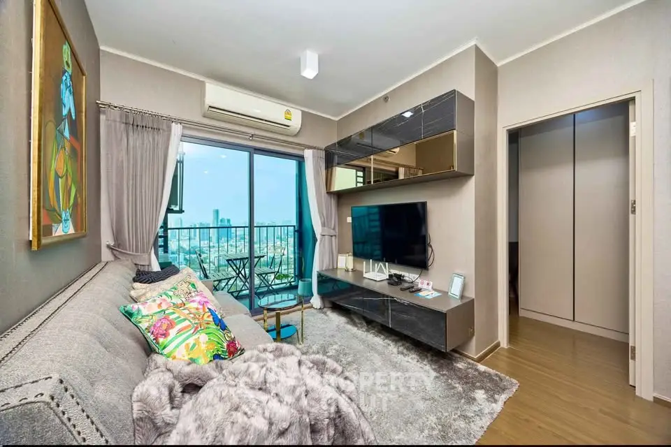 Modern living room with city view, stylish decor, and cozy seating area.